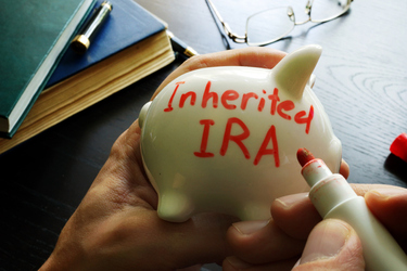 Ways to minimize taxes when you inherit an IRA